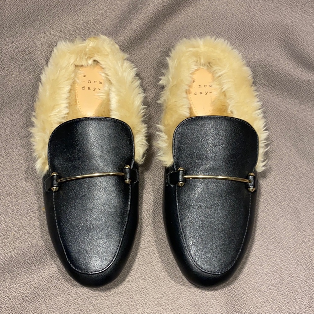 Excellent condition A new day  black slides with fur/. Size 6 1/2